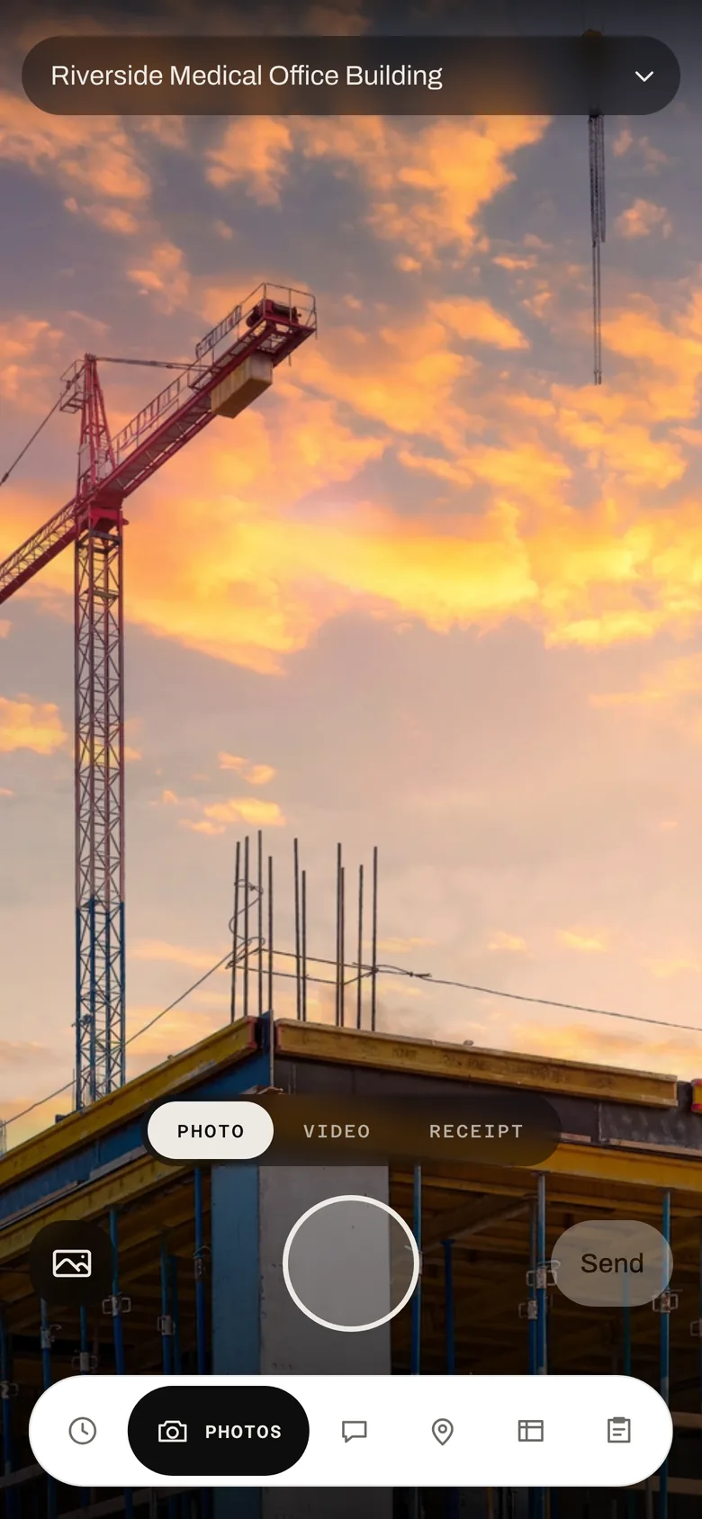The field app's camera tab pointed at a building under construction